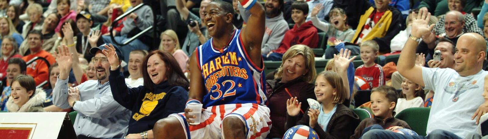 photo of a harlem globetrotter and fans in the nutter center